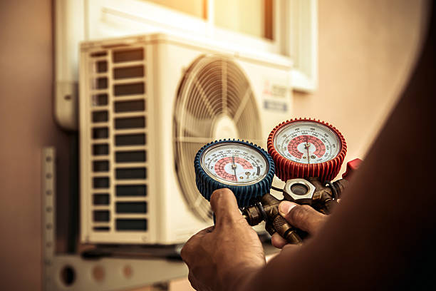 Professional Air Conditioning Service technician working in Sublimity, OR